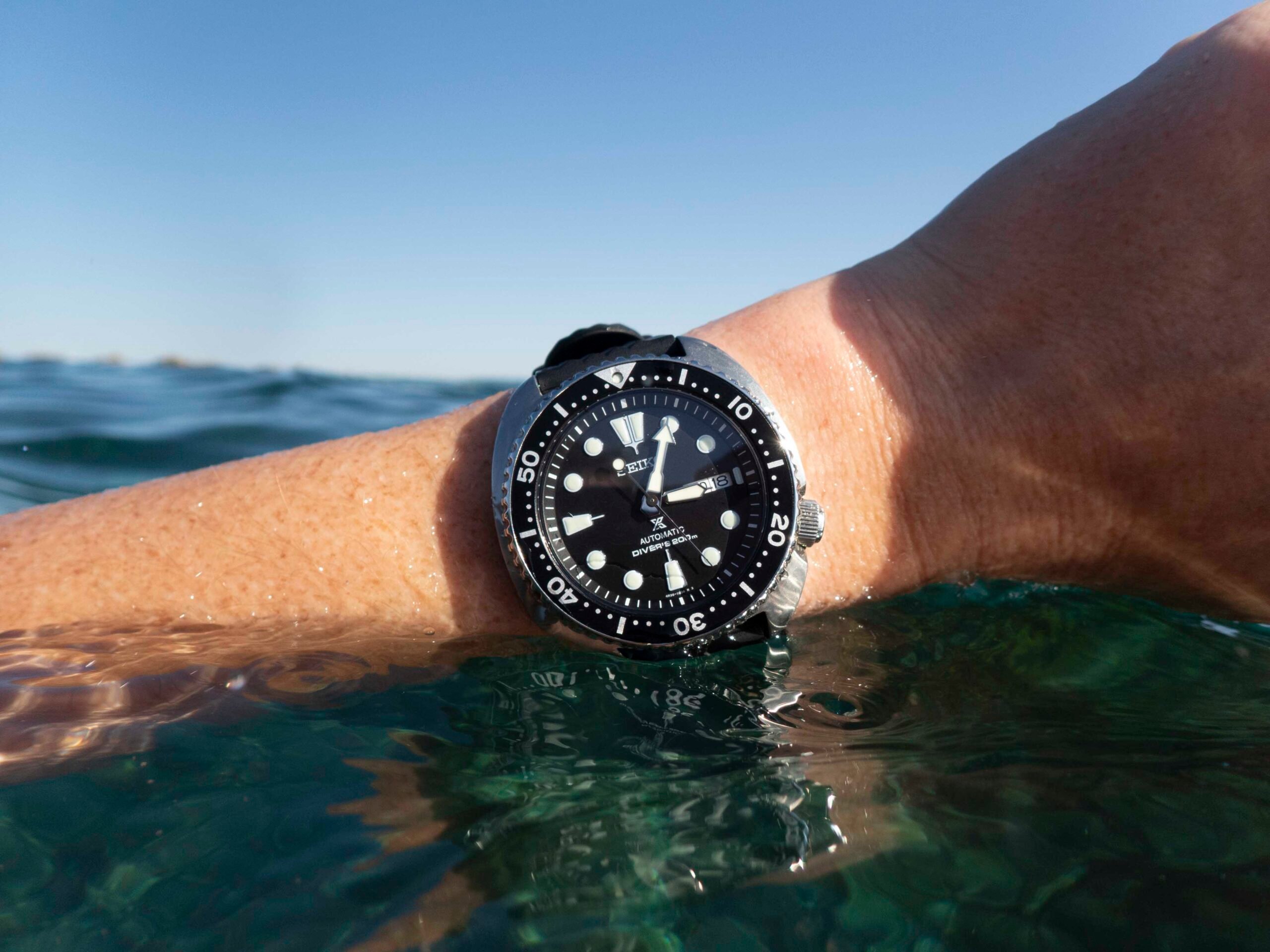 Seiko Turtle SRPE93 on wrist in water