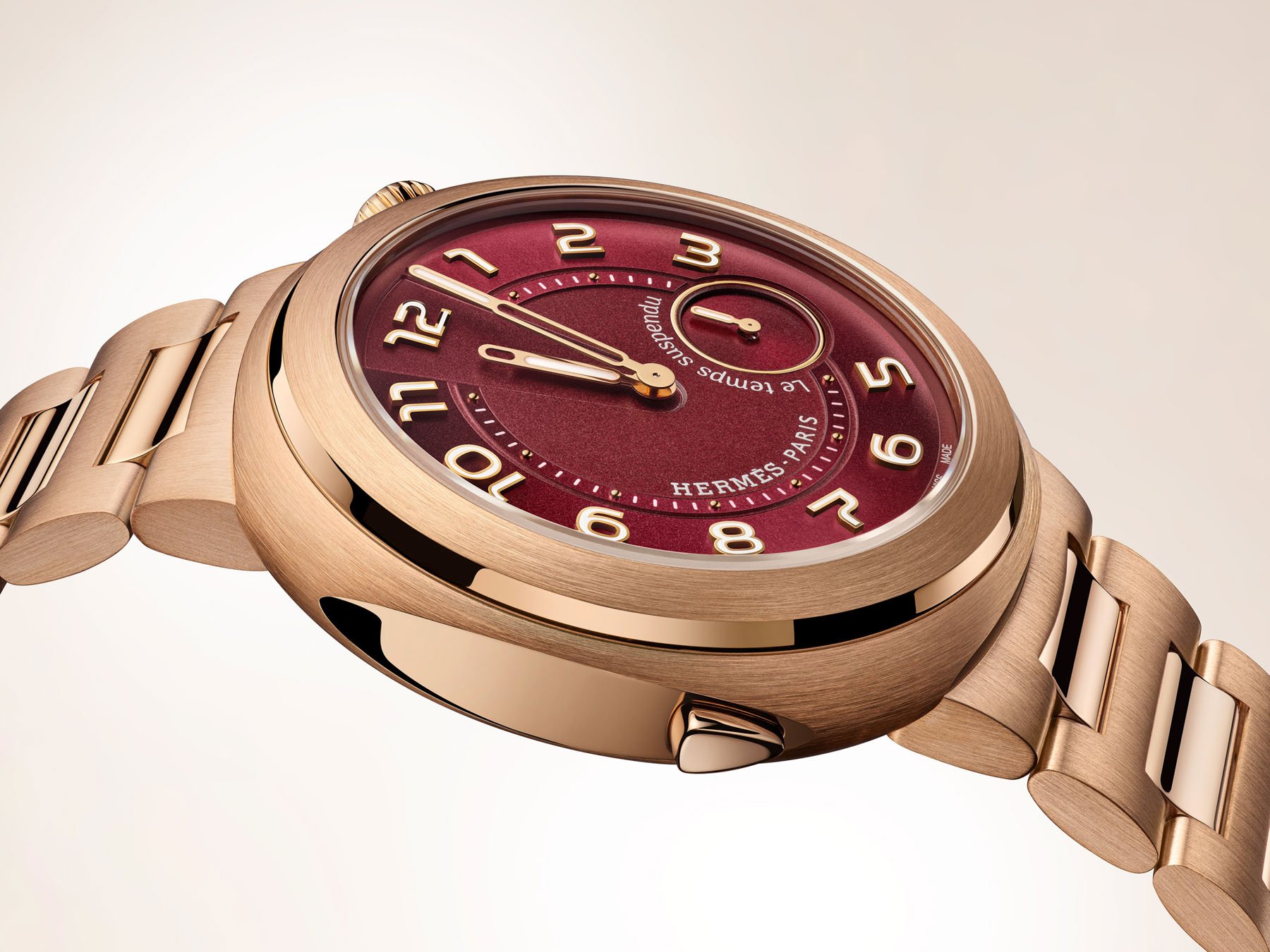 rose gold and burgundy Hermès Cut Le Temps Suspendu profile view